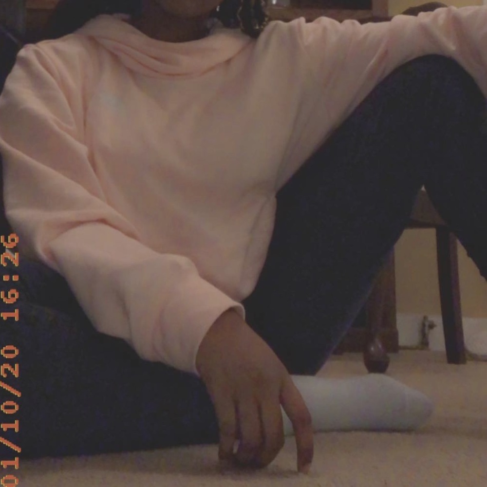 A light pink Nike hoodie